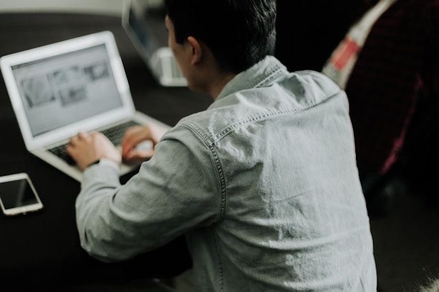 image of a man working on his laptop